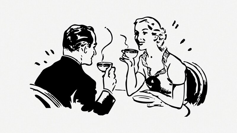 Two people talking face to face over coffee