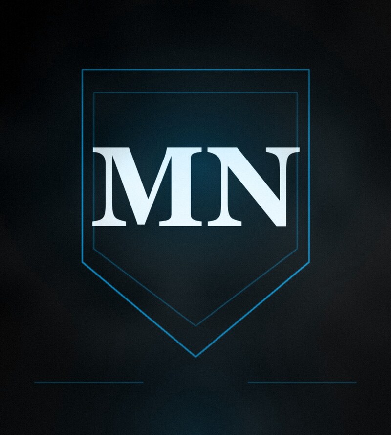 MN monogram crest on a dark blue background